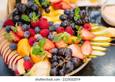 Fruit Platter On A Plate For A Festive Table. Berries And Chopped Fruits Is A Delicious And Healthy Vegetarian Dessert. Catering.