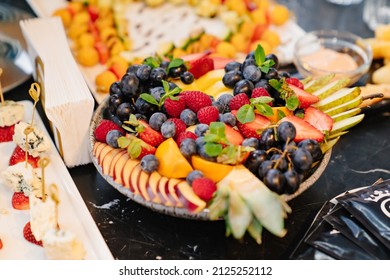 Fruit Platter On A Plate For A Festive Table. Berries And Chopped Fruits Is A Delicious And Healthy Vegetarian Dessert. Catering.