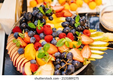 Fruit Platter On A Plate For A Festive Table. Berries And Chopped Fruits Is A Delicious And Healthy Vegetarian Dessert. Catering.