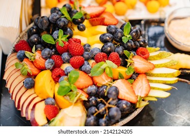 Fruit Platter On A Plate For A Festive Table. Berries And Chopped Fruits Is A Delicious And Healthy Vegetarian Dessert. Catering.