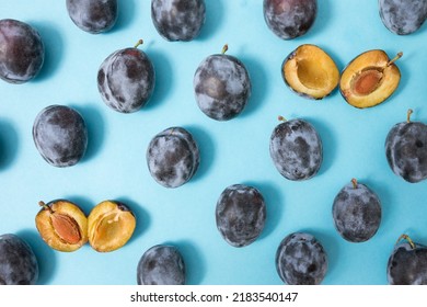 fruit plum background, fresh plum half and whole plums pattern, summer creative layout top view - Shutterstock ID 2183540147