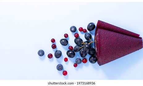 Fruit Roll Up With Blueberries And Berries Top View.  Vegetarian Fruit Snack.