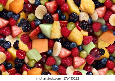 Fruit salad background as fresh berries and cut fruits as blueberry blackberry strawberries melon cantaloupe raspberry pineapple banana and grapes as a symbol of healthy lifestyle and living well. - Powered by Shutterstock