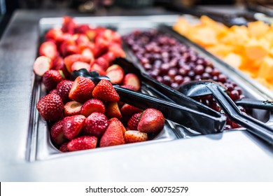 Fruit Salad Bar With Whole Strawberries And Grapes