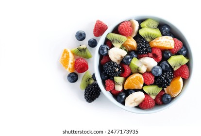 Fruit salad in a blue bowl isolated on white background. Top view. Copy space - Powered by Shutterstock