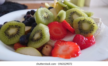 Fruit Salad With Cottage Cheese. Cottage Cheese With Pieces Of Fruit. Curd With Kiwi Slices, Strawberry Slices, Blueberries, And Apple Slices.