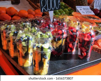 fruit salad mixing in plastic box with plastic fork for tourists in a famous food market in Budapest, Hungary