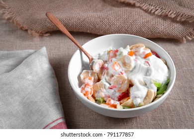 Fruit Salad Of Oranges, Grapefruit, Bananas, Kiwi Dressed With Natural Yoghurt And Sprinkled With Chopped Apple