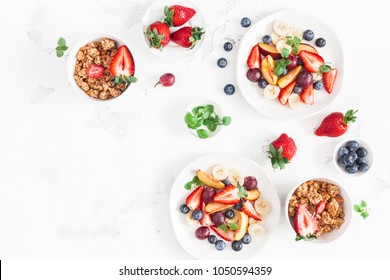 Fruit Salad With Strawberry, Blueberry, Peach, Banana, Grape And Fresh Fruits On White Background. Flat Lay, Top View, Copy Space