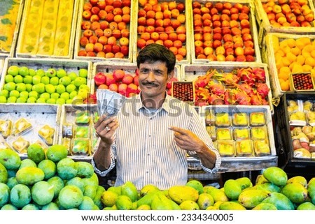 Fruit shop - Indian male street vendor selling fresh fruits