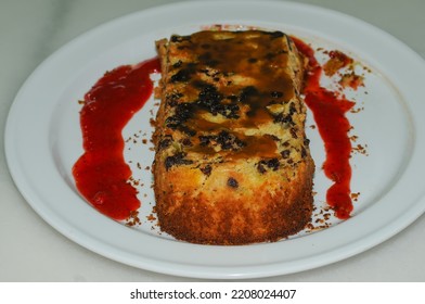 Fruit Sponge Cake, Homemade With Strawberry Jam On White Plate