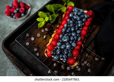 Fruit Tart Full Of Berries With Chocolate And Cream On Cookie Crust. European Dissert.