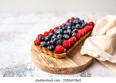 Fruit Tart Full Of Berries With Chocolate And Cream On Cookie Crust. European Dissert.