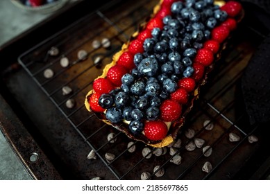 Fruit Tart Full Of Berries With Chocolate And Cream On Cookie Crust. European Dissert.