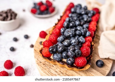 Fruit Tart Full Of Berries With Chocolate And Cream On Cookie Crust. European Dissert.