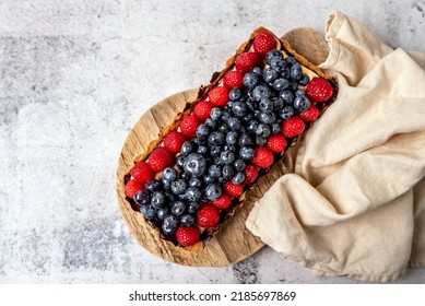 Fruit Tart Full Of Berries With Chocolate And Cream On Cookie Crust. European Dissert.