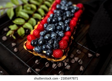 Fruit Tart Full Of Berries With Chocolate And Cream On Cookie Crust. European Dissert.