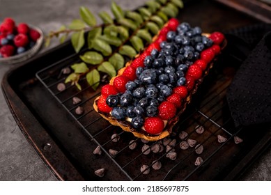 Fruit Tart Full Of Berries With Chocolate And Cream On Cookie Crust. European Dissert.