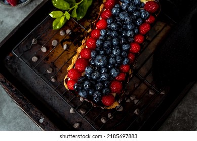 Fruit Tart Full Of Berries With Chocolate And Cream On Cookie Crust. European Dissert.