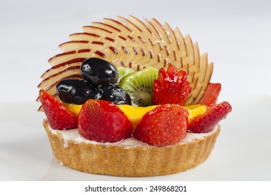 Fruit Tart Of Strawberry, Kiwi, Black Grape, Apple And Mango Slices For Valentines Day Isolated On White Background