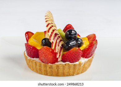 Fruit Tart Of Strawberry, Kiwi, Black Grape, Apple And Mango Slices For Valentines Day Isolated On White Background