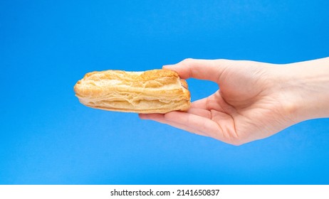 Fruit Turnover Pastry Side View In Hand On Blue Background