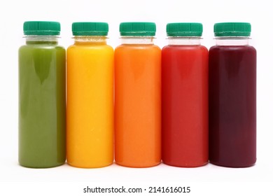 Fruit and Vegetable Juice in plastic Bottles isolated on white Background, copy space, mock up.