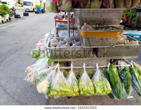 Fruit and vegetable shop in Thailand. Cars for\
sale in Thailand.