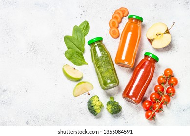 Fruit And Vegetable Smoothie Drink. Tomato, Spinach And Carrot Fresh Blended Drink. Top View On White Stone Background.