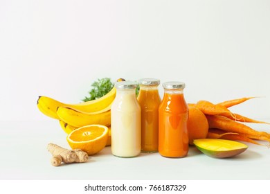 Fruit And Vegetable Smoothies In Glass Jars, Orange Mango Banana Carrot Pineapple