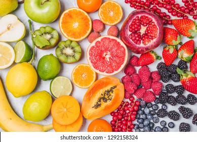Fruits and berries rainbow top view background.Natural vitamins and antioxidants food concept.