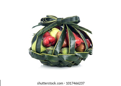 Fruits In Coconut Palm Frond Weaving Basket Isolated On White Background.