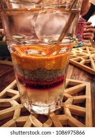 Fruits Drinking Water With 3 Layers , 1st Layer Is Strawberry, 2nd Layer Is Hairy Basil And 3rd Is Yellow Yelly. It Is Very Delicious.