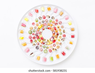 Fruits lollipops, heart and smile. Candy, top view flat lay, handmade pattern on white background. Sweet sucker, lollipop, candy, isolated minimal concept above decoration, food background