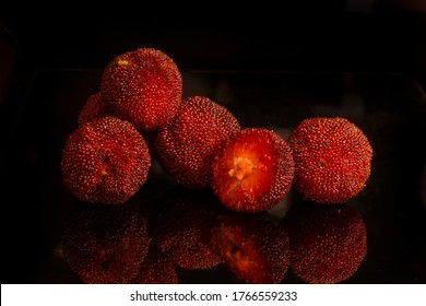 Fruits of Myrica rubra, also called yangmei, yamamomo, Chinese bayberry, Japanese bayberry, red bayberry, yumberry, waxberry, or Chinese strawberry is a crimson to dark purple-red, fruit.