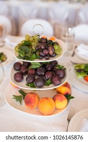 Fruits: Peaches, Plums, Grapes Are On A Tray On Candy Bar. Plenty Of Mixed Various Kinds Of Fruits On A Big Tray On Table. Fruit Platter. Catering For Wedding Party.