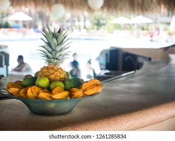 Fruits In Plate At Resort Pool Bar Under Palapa. Tropical Vacations
