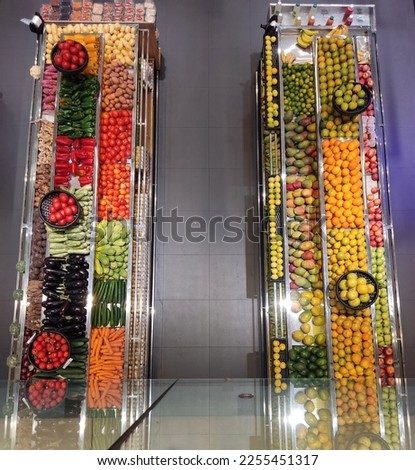 Fruits and vegetables display rack supermarket aisle. Organic veggie food store top view. Healthy eating diet lifestyle. 