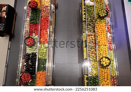 Fruits and vegetables display rack supermarket aisle. Organic veggie food store top view. Healthy eating diet lifestyle. 