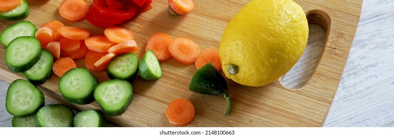 Fruits And Vegetables On Wooden Chopper Table