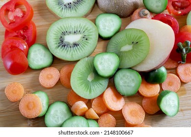 Fruits And Vegetables On Wooden Chopper Table