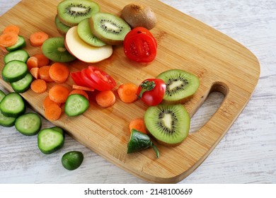 Fruits And Vegetables On Wooden Chopper Table