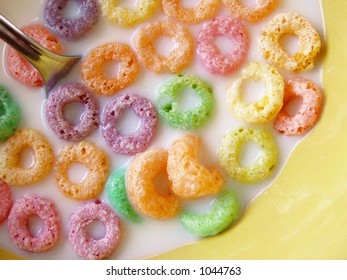 Fruity O Cereal In Yellow Bowl With Milk And Spoon