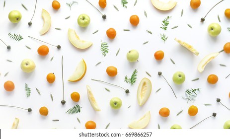 Fruity Pattern. Melon, Green Apples, Plants And Flowers On A White Background. Food Background. Top View.