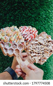 Fruity Pebble And Cinnamon Waffle In Front Of Green Backdrop