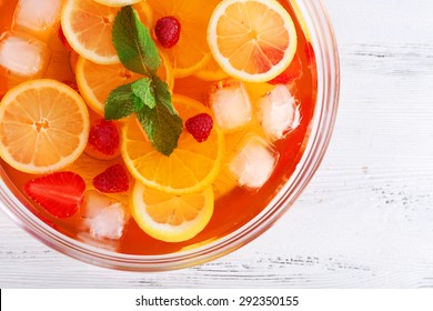 Fruity Punch In Glass Bowl On Wooden Table, Top View