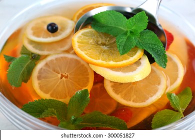 Fruity Punch In Glass Bowl On Wooden Table, Closeup