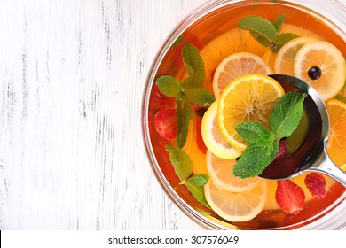 Fruity Punch In Glass Bowl On Wooden Table, Top View