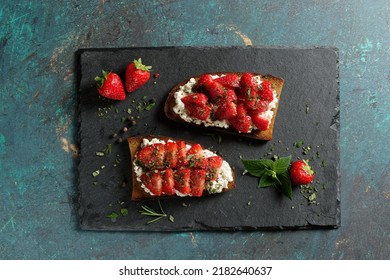 Fruity toast with strawberries on cottage cheese. Healthy toast (tartine).  - Shutterstock ID 2182640637