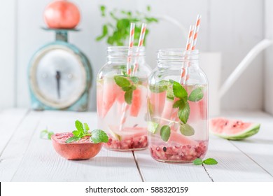 Fruity Water In Jar With Watermelon, Pomegranate And Mint Leaves